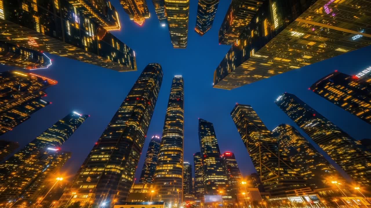 Transition from Day to Night: A Stunning Overview of Urban Skyscrapers Illuminated by City's Glow, Capturing the Essence of Modern Architecture and Vibrant City Life