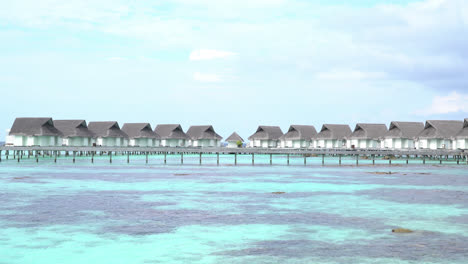 tropical-beach-and-sea-in-Maldives-with-bungalow