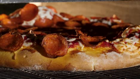 pepperoni pizza baking in an oven