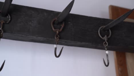 Rusty-Steel-Hooks-At-Slaughterhouse-Of-Sandor-Petofi-Memorial-Exhibition-in-Szalkszentmarton,-Hungary