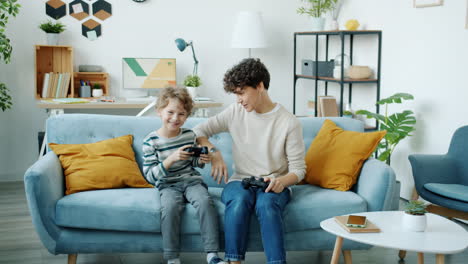 mother and son playing video games together