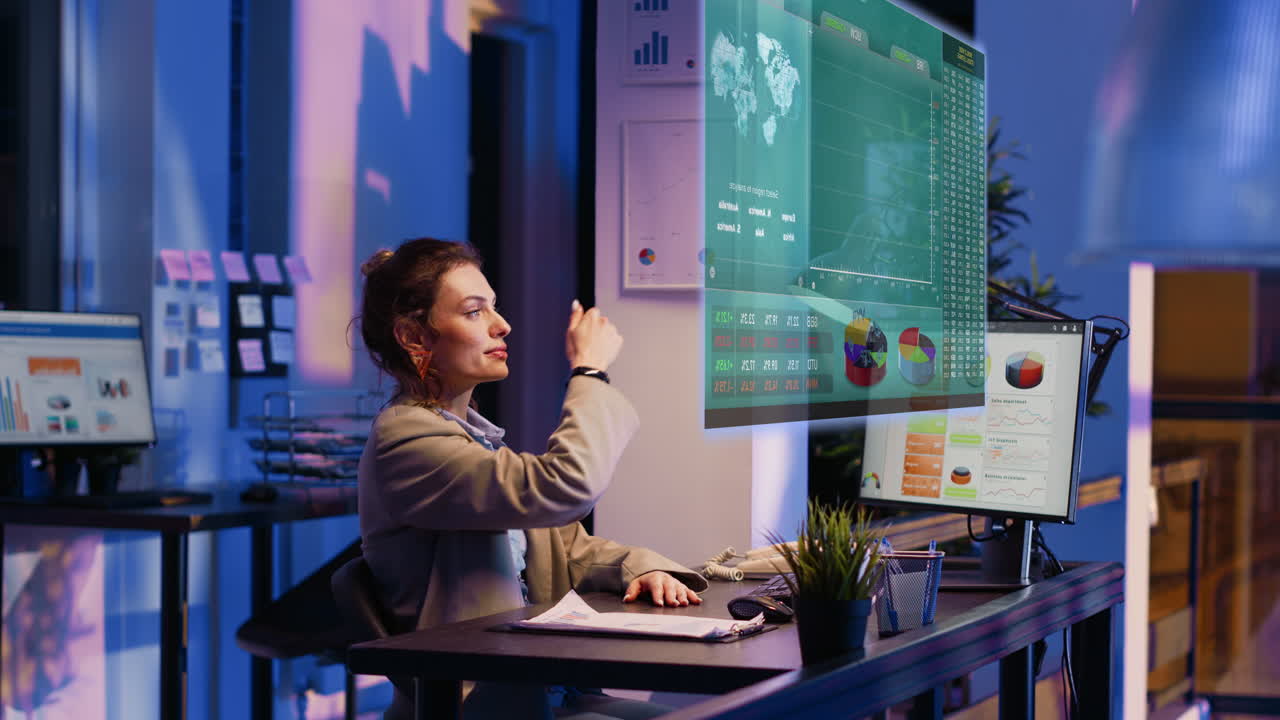 Employee checking analytics hologram