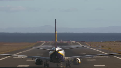 airplane taking off and flying over the sea