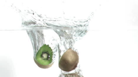 kiwis falling into water in super slow motion