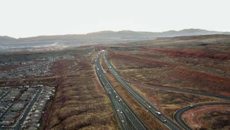 aerial view of a highway and residential area in a desert landscape