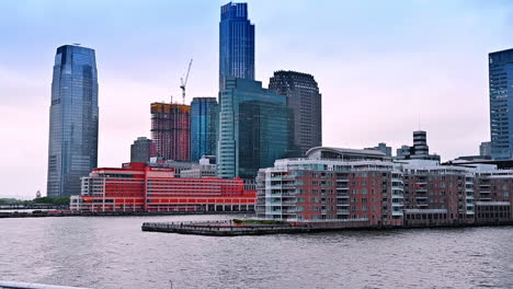 multi-storied buildings constructed on the pier. low angle view at the architecture on the waterfront of new york, usa