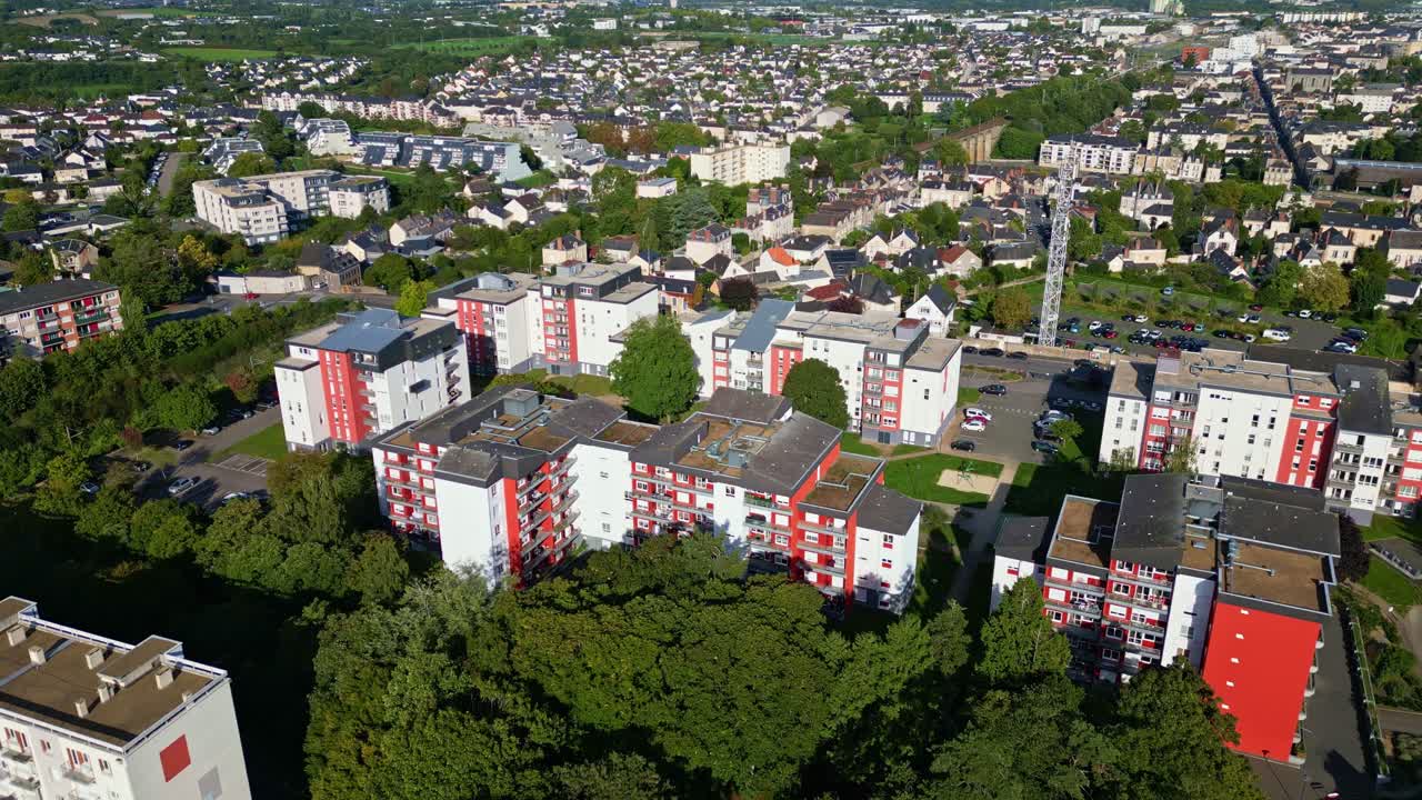 Aerial of Laval cityscape with buildings, green trees, blue sky, urban lscape