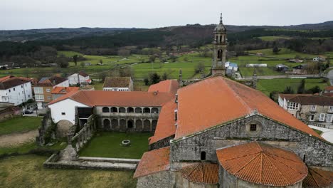 drone dolly from backside of santa maria de xunqueira courtyard at monastery