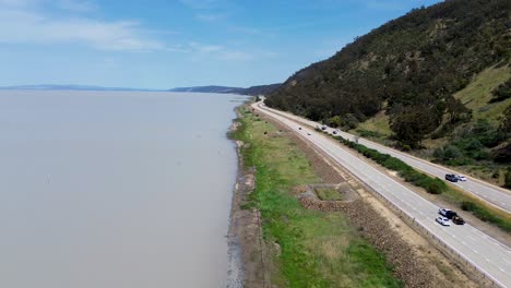 Drone-aerial-landscape-valley-mountain-roadside-trip-cars-on-Lake-George-Federal-Highway-NSW-Canberra-ACT-Sydney-travel-tourism-transport-Australia-4K