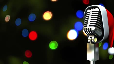 Santa-hat-over-microphone-against-colorful-spots-of-light-against-green-background