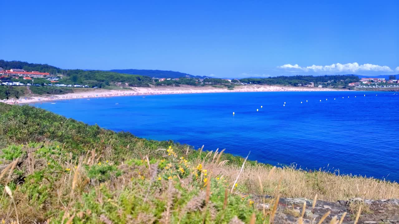 Time Lapse of Large Beach with Blue Water Between Villages in Galicia Spain
