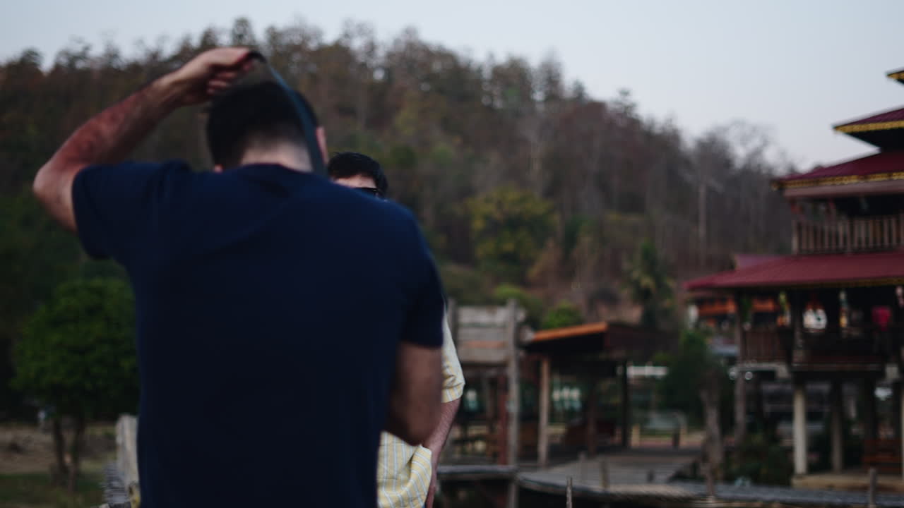 People taking pictures in front of a building