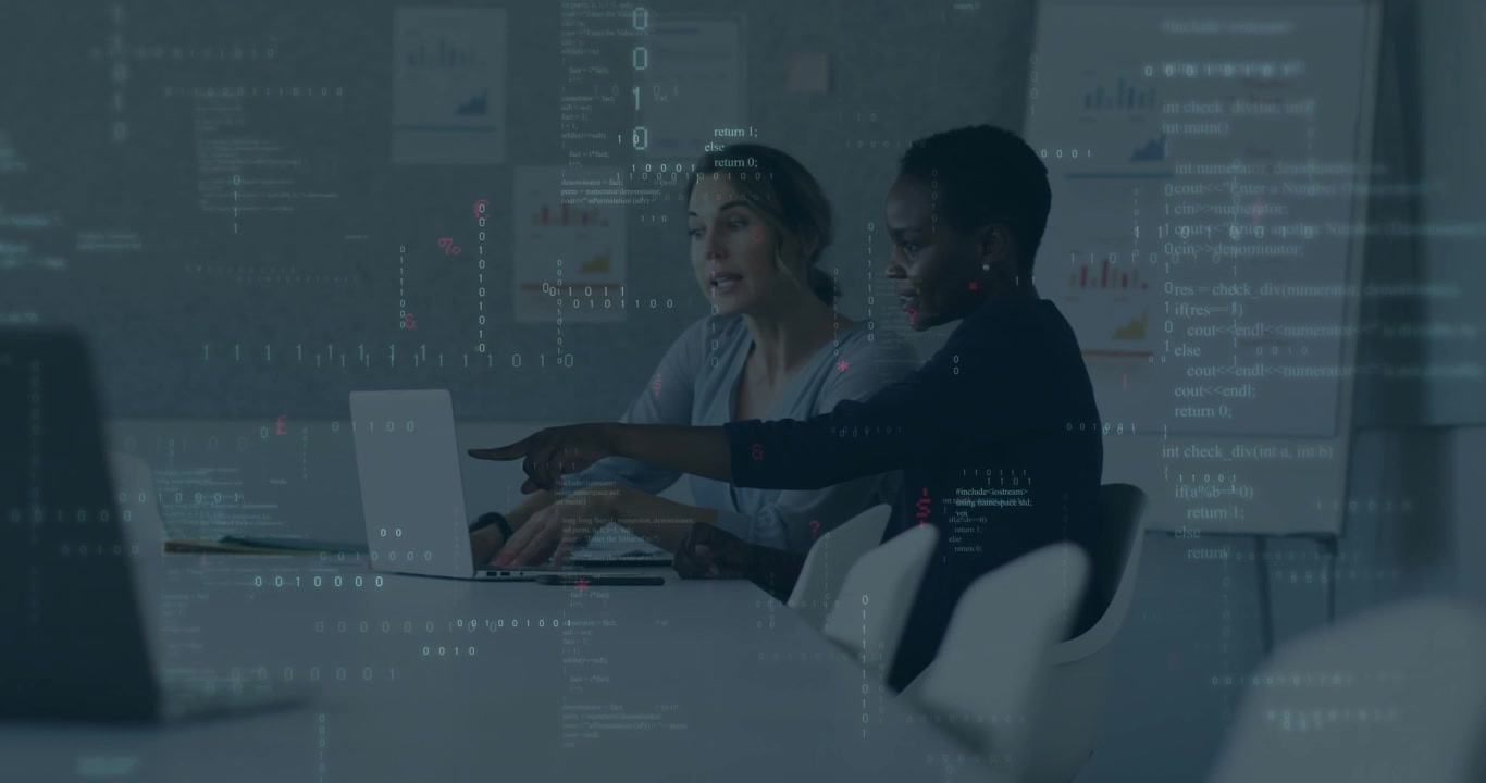 two female developers pointing at laptop and initiating coding while aligning code with chart trend