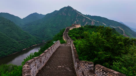 drone flying along the huanghuacheng lakeside great wall, gloomy day in china
