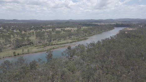 Aerial-View-Of-Boyne-River-And-Lush-Tree-Forest-Near-Benaraby-Town,-Far-North-Queensland,-Australia