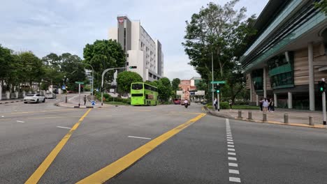 vehicles and pedestrians crossing an urban intersection.