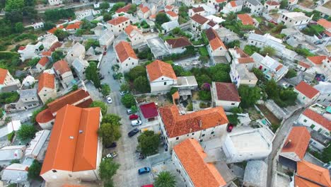 Birds-eye-view-of-St,-Nicholas-Church-and-the-surrounding-buildings-in-Selca-Croatia