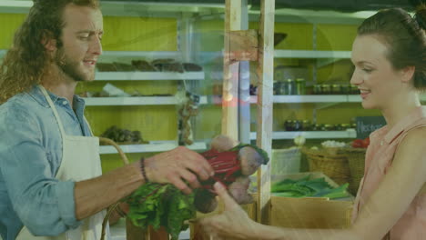animación de gráficos financieros sobre un feliz vendedor caucásico y una cliente en una tienda de comestibles
