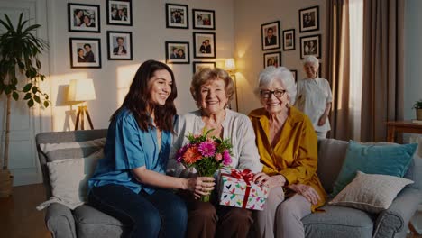 grandmothers surprised with gifts and flowers
