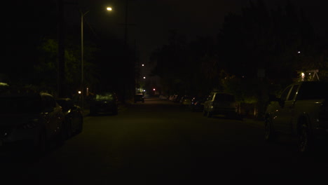 Los-Angeles's-isolated-street-where-cars-are-parked-in-the-opposing-lane-at-night-is-near-the-courthouse-and-city-hall