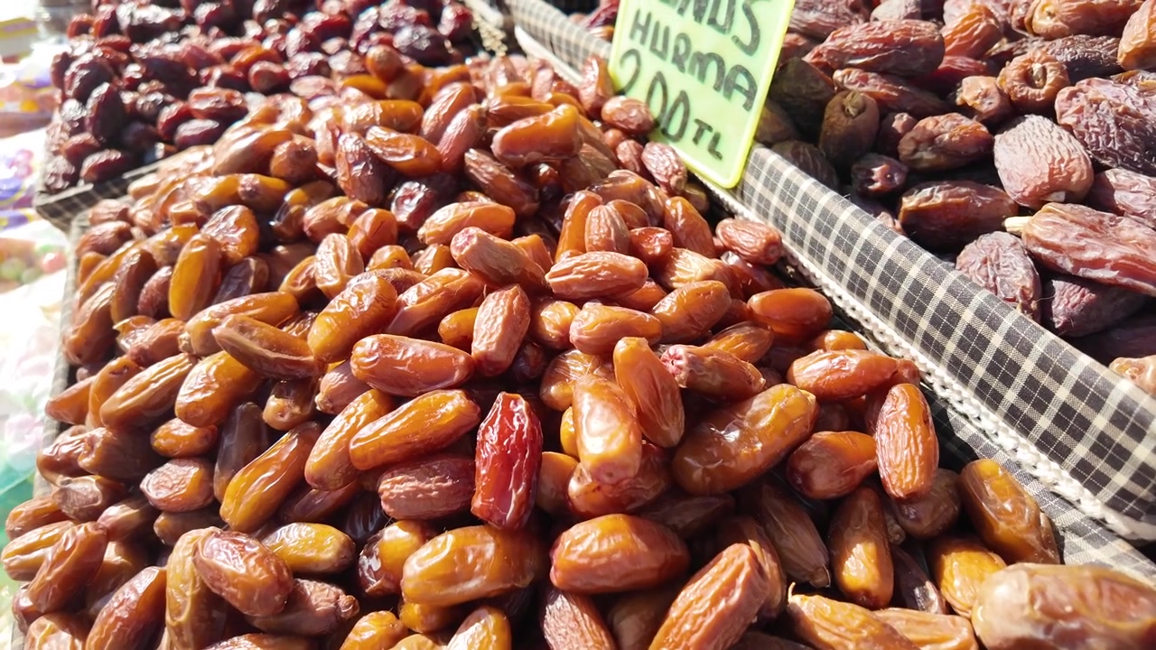 Close-Up of Dried Dates for Sale at a Market Stall
