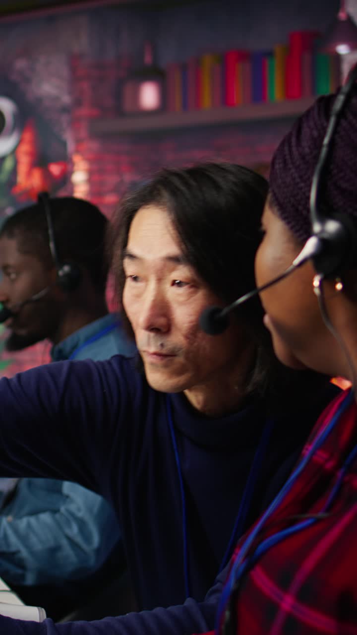 Vertical video Senior account manager teaching intern how to talk with customers