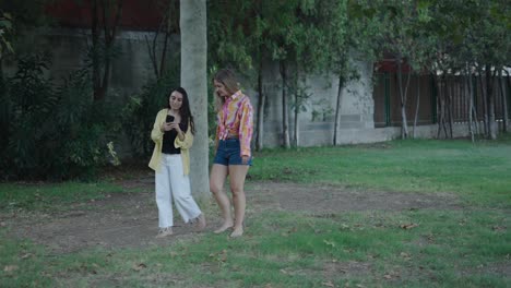 two young women walking in the park