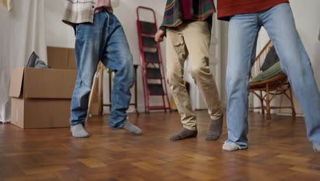 friends dancing in a new home