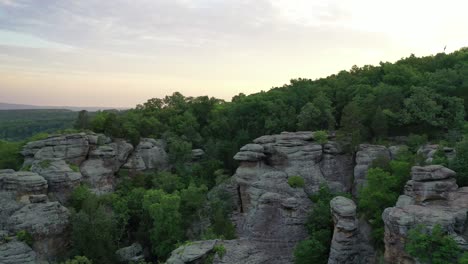 forestry landscape with rocky cliff in aerial drone view