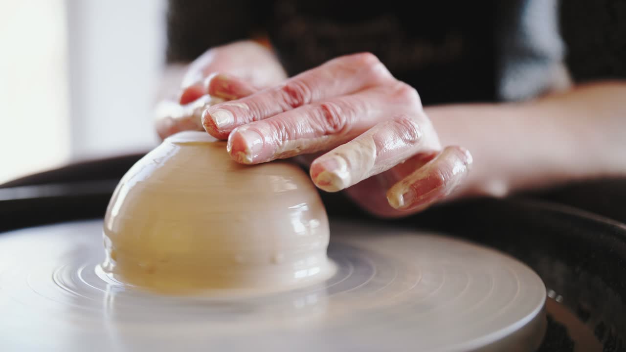 Potter's wheel potter works with his hands