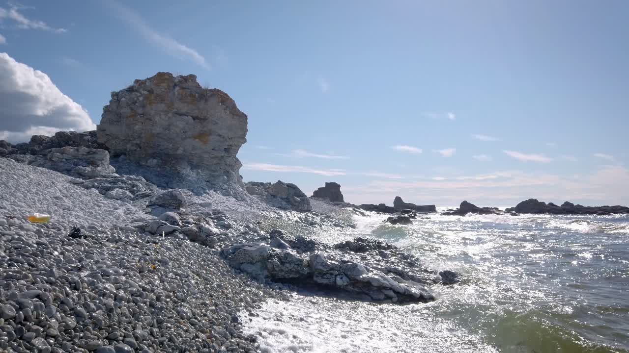Rauk limestone formation by sea in Faro island, Baltic landscape on sunny day, handheld