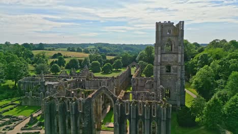 drone aerial footage of the historical 13th century fountains abby ruins in north yorkshire - england uk