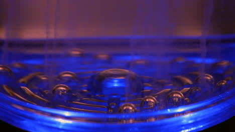 liquid cooled by an alkaline ph water filter. bubbles rise as the molecular structure of h20 is changed in the cooling system