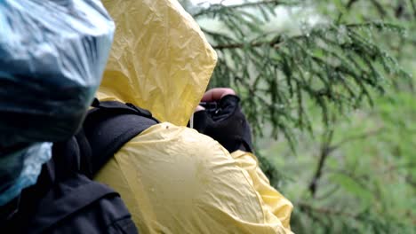 hiker taking photos in the rain