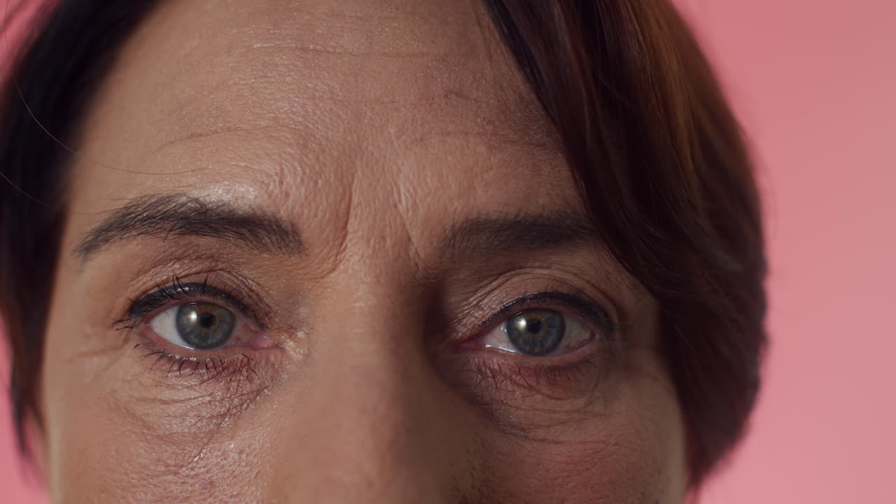 Blue Eyes of Mature Woman Looking at Camera