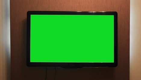 wall-mounted tv with green screen