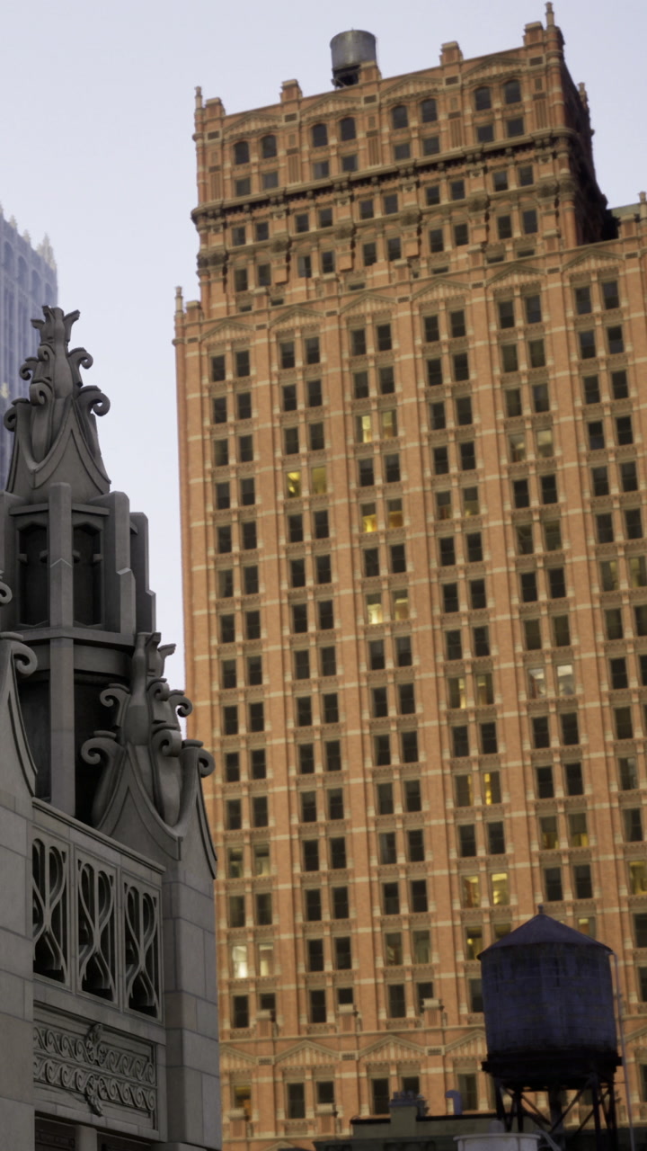 Building structures stand together in a city scene during evening hours