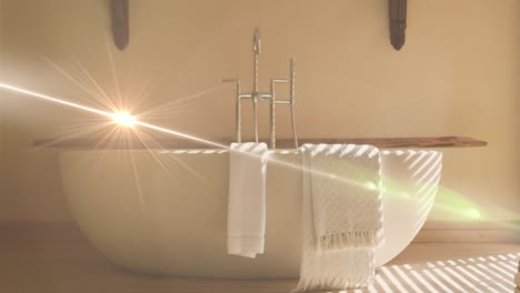 animation of light spots over bath and towels