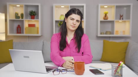 home office worker woman nods to the camera, says no, no.