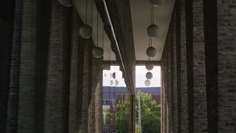 tracking shot under an archway in the city of ulm