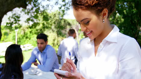 Waitress-taking-an-order-in-restaurant