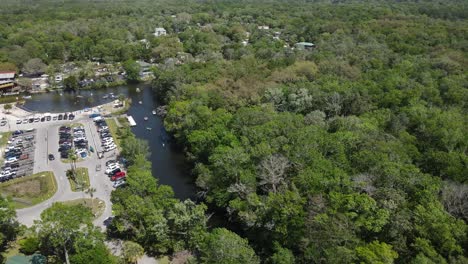 heavily-forested-land-right-by-Roger's-Park,-and-kayaking-from-weekend-warriors