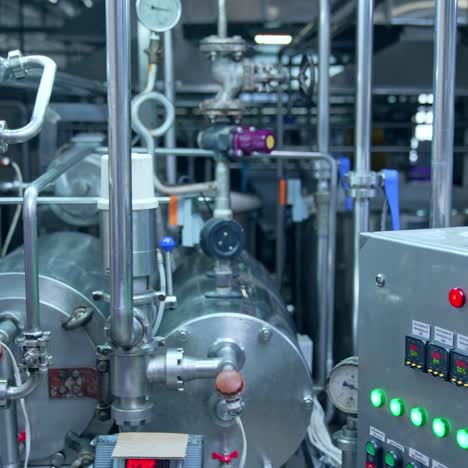 close look at the pipelines with valves and barometer. special equipment with buttons and timer for controlling the production processes. close up