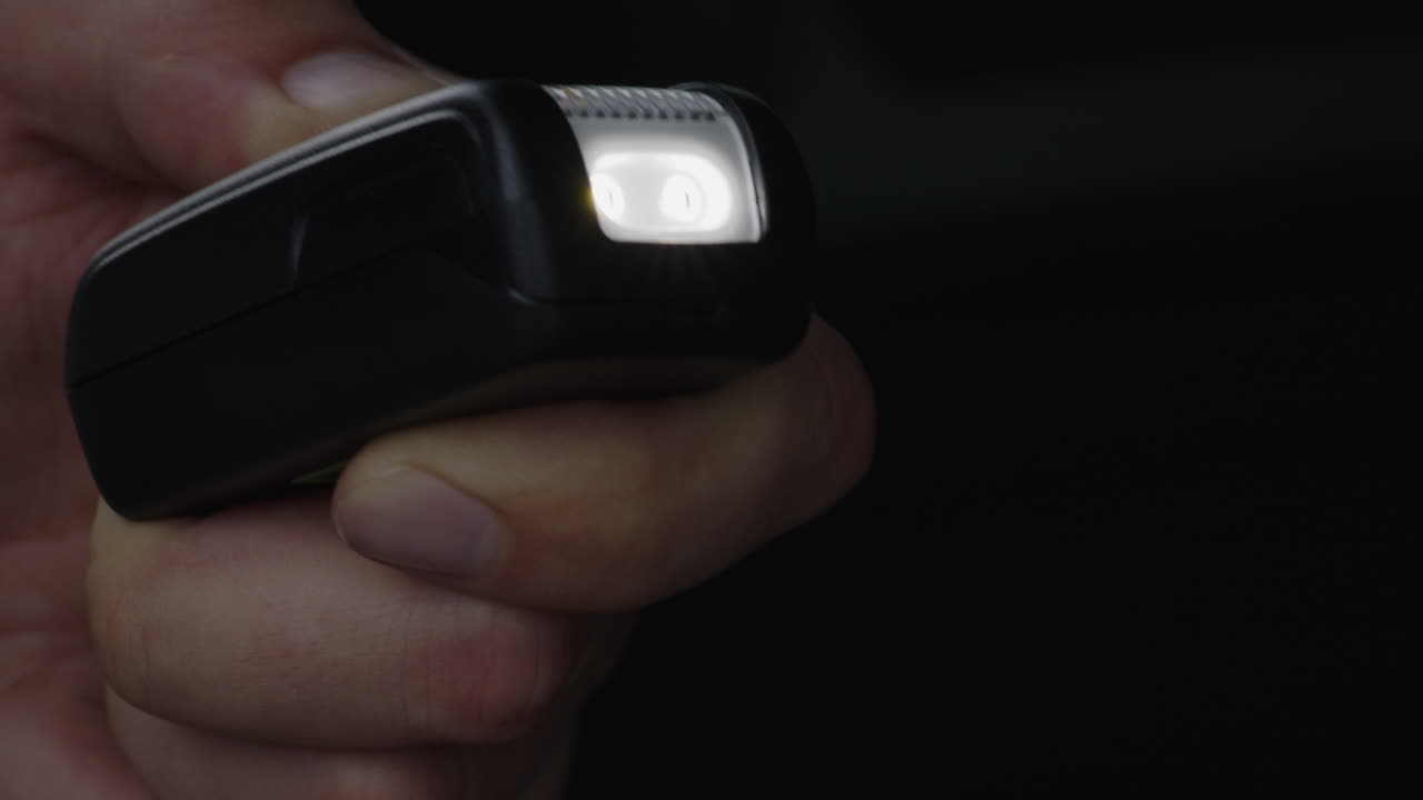 Close-up of turning a car emergency flashlight on and off