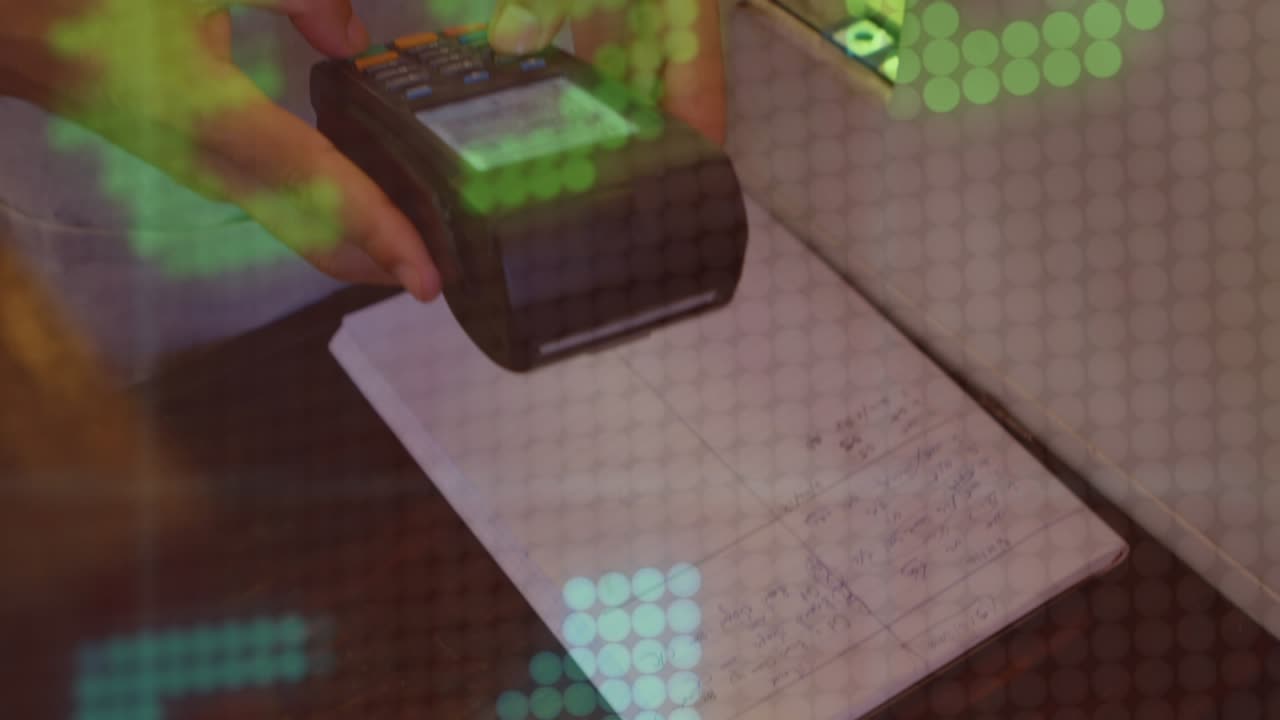 Animation of financial data processing over caucasian woman paying with watch at payment terminal