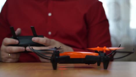Caucasian young man driving drone