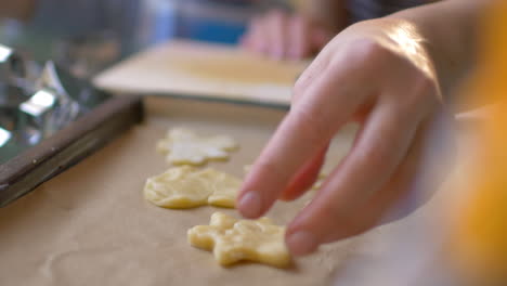 cutouts of cookie dough on baking tray