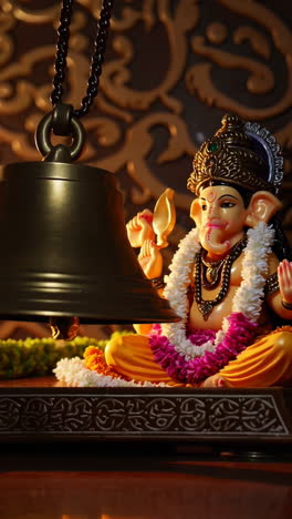 hindu prayer bell and ganesha statue