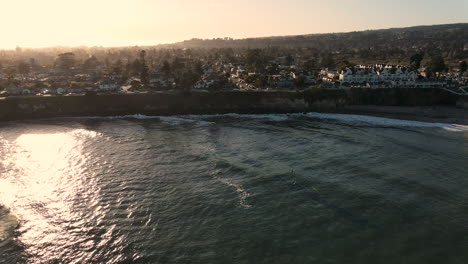 aerial view of santa cruz beach california with surfers shot in 4k high resolution