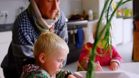 father taking care of his children at home 4k